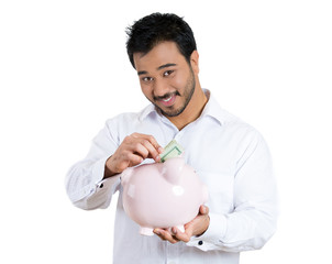 Man, worker holding piggy bank depositing money