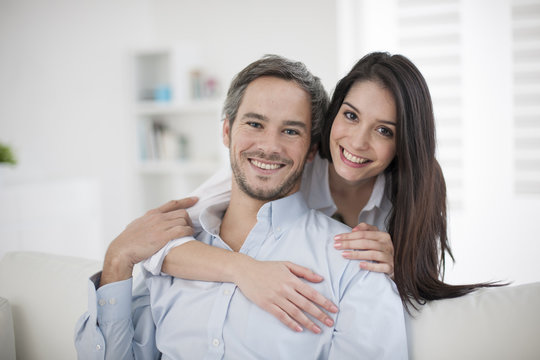 Couple At Home Relaxing In Sofa