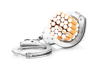 Addition concept with cigarettes and handcuffs