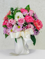 Flower bouquet in white ceramic vase