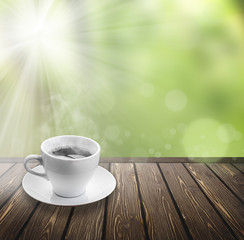 coffee on wood floor with green bokeh .