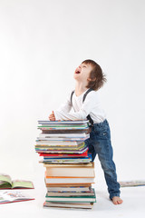 Boy with a pile of books