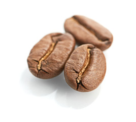 Macro of coffee beans isolated on white background