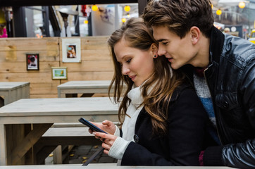 Couple Using Mobile Phone Together