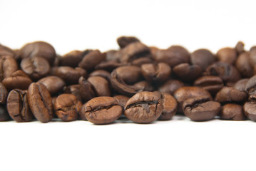 Roasted coffee beans on white background