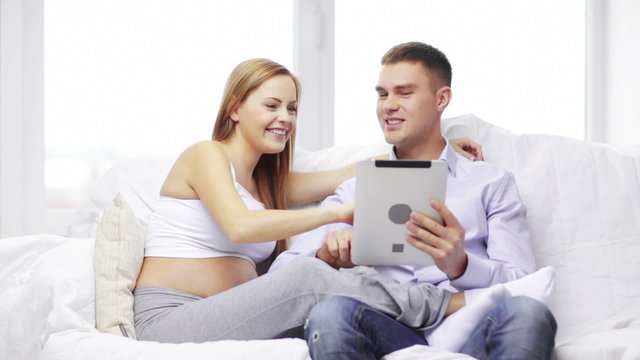 happy family looking with tablet pc computer