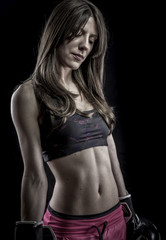 Fototapeta na wymiar Body, strong woman athlete with boxing gloves