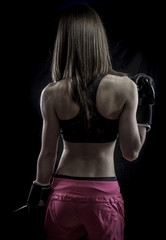 Fototapeta na wymiar Healthy, strong woman athlete with boxing gloves