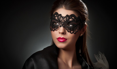 Portrait of attractive sensual young woman with mask