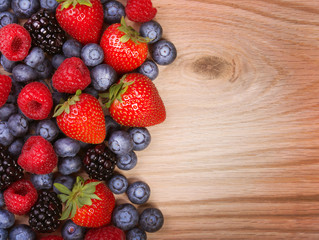 Berries on Wooden Background. Strawberries, Blueberry, Raspberri