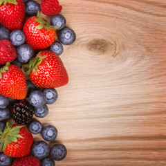 Berries on Wooden Background. Strawberries, Blueberry