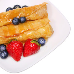 Crepes with Berries. Rolled Pancakes with Strawberry, Blueberry