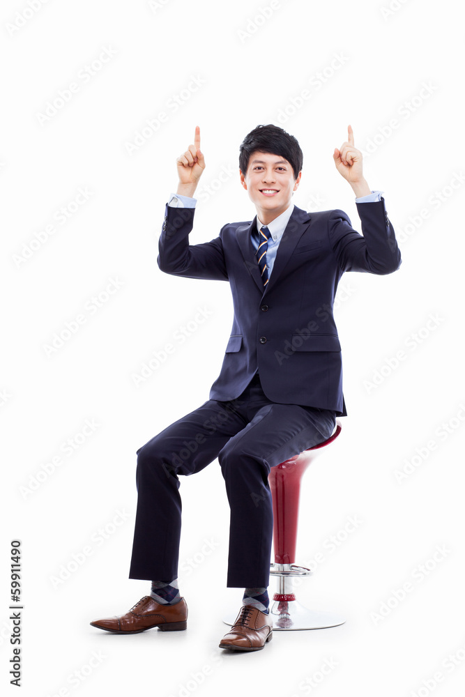 Wall mural young asian business man showing something