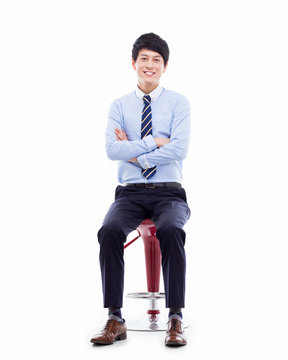 Young Asian Business Man Sitting On The Chair.