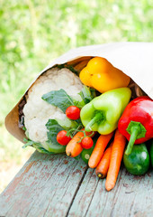 fresh organic  vegetables on a wooden bench
