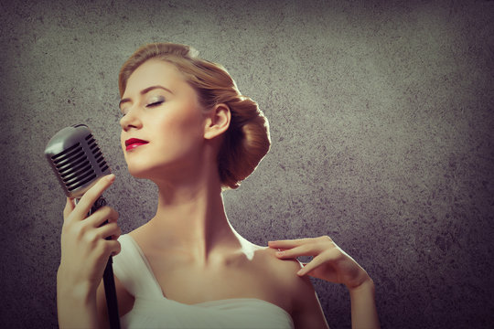attractive female singer with microphone
