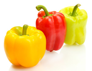 fresh yellow, red and green bell peppers isolated on white
