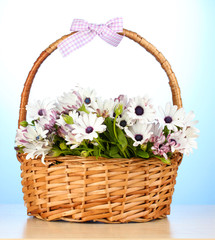 Fototapeta na wymiar bouquet of beautiful summer flowers in basket,