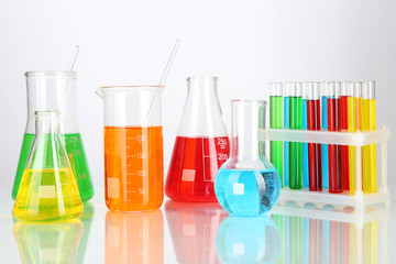 Test tubes with colorful liquids isolated on white