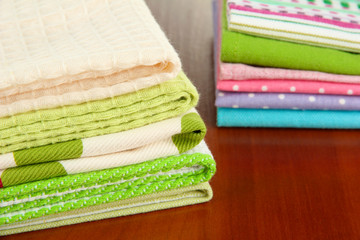 Kitchen towels, on wooden background