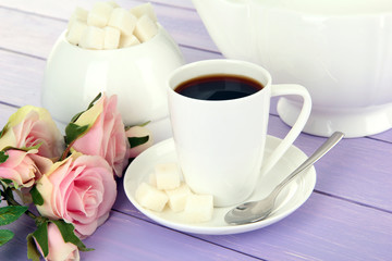 Cup of coffee, on color wooden background