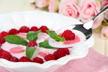 Sweet cream soup with fresh raspberry and sour cheese,