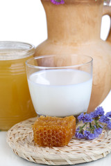 Honey and milk isolated on white