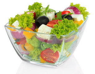 Greek salad on plate isolated on white