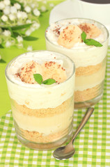 Delicious dessert with banana and caramel on table close-up