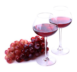 Wineglasses with red wine, grape isolated on white