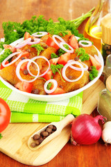 Turkey meat in bowl on wooden table close up