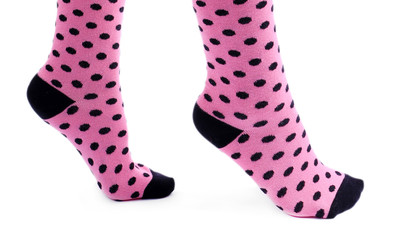 Female legs in colorful socks, isolated on white