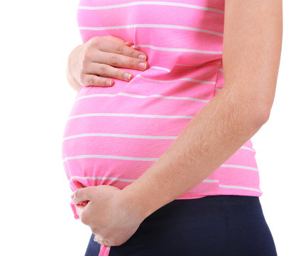 Pregnant woman touching her belly isolated on white