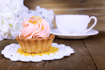 Tasty cake on table on wooden background