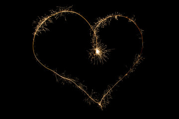 Heart of sparklers on black background - 59917236