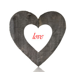wooden heart shape and red love
