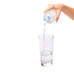 Female hands pouring water into a glass