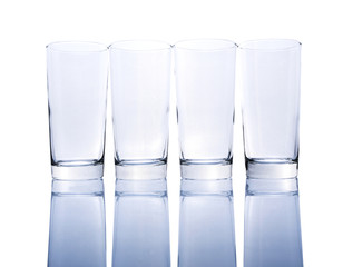 Row of empty glasses over white background