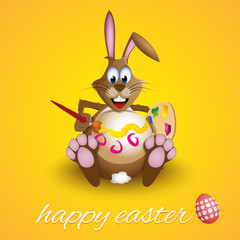 Easter bunny rabbit decorating his egg-like belly