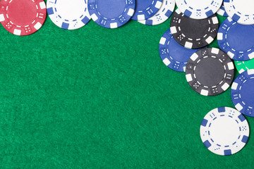 poker chips on a green table background