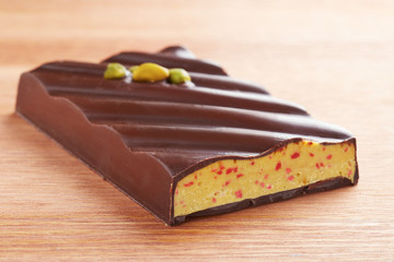 Dark chocolate bar with pistachio and strawberry