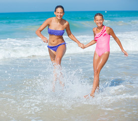 Girls running beach