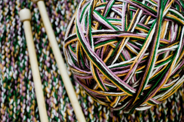 Great ball of colored yarn, wooden knitting needles