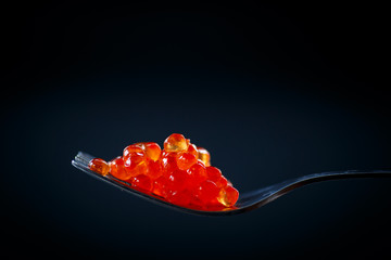 red caviar on a fork