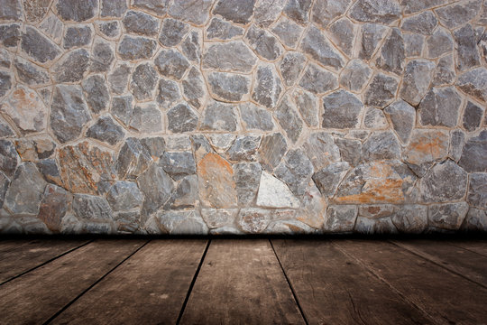 Pattern of decorative stone wall and wood flooring surface