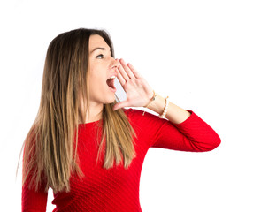 Young girl shouting over isolated white background