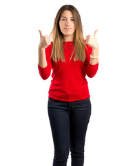 Obraz premium Young woman making Ok sign over white background