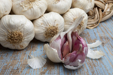 String of garlic on wooden background