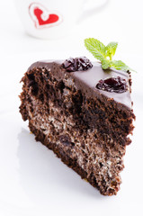 Piece of chocolate cake with cherries