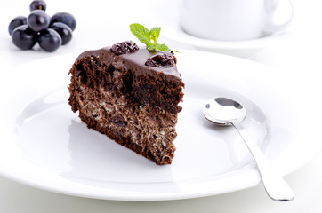 Piece of chocolate cake with cherries